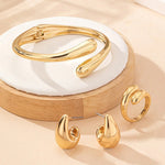 Conjunto Saint Carvalho Lumière — Pulseira, Anel e Brincos Dourados