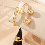 Conjunto Saint Carvalho Lumière — Pulseira, Anel e Brincos Dourados